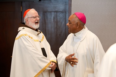 Boston Cardinal Sean P. O’Malley and Atlanta Archbishop Wilton D. Gregory, chairman of the National Catholic Educational Association's board of directors, speak before the opening Mass the NCEA's 2012 convention in Boston April 11. Pilot photo By Gregory L. Tracy