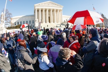 Boston pilgrims stand outside of the Supreme Court during the March for Life Jan. 22, 2014.  (Pilot photo by Gregory L. Tracy)