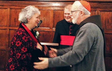 StJ_006_Pilot 6 - SJS Trustee Loretta Gallagher accepting award from Cardinal copy