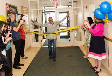 The 2014 Boston Marathon Men’s winner Meb Keflezighi visits Catholic Charities’ Laboure Center in South Boston May 15, 2014. (Pilot photo/ Christopher S. Pineo) 