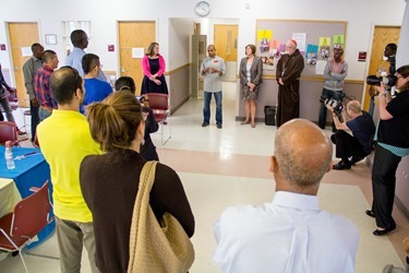 The 2014 Boston Marathon Men’s winner Meb Keflezighi visits Catholic Charities’ Laboure Center in South Boston May 15, 2014. (Pilot photo/ Christopher S. Pineo) 