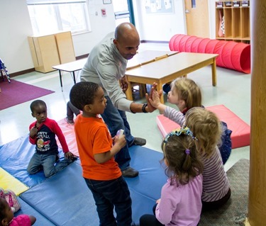 The 2014 Boston Marathon Men’s winner Meb Keflezighi visits Catholic Charities’ Laboure Center in South Boston May 15, 2014. (Pilot photo/ Christopher S. Pineo) 