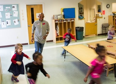 The 2014 Boston Marathon Men’s winner Meb Keflezighi visits Catholic Charities’ Laboure Center in South Boston May 15, 2014. (Pilot photo/ Christopher S. Pineo) 